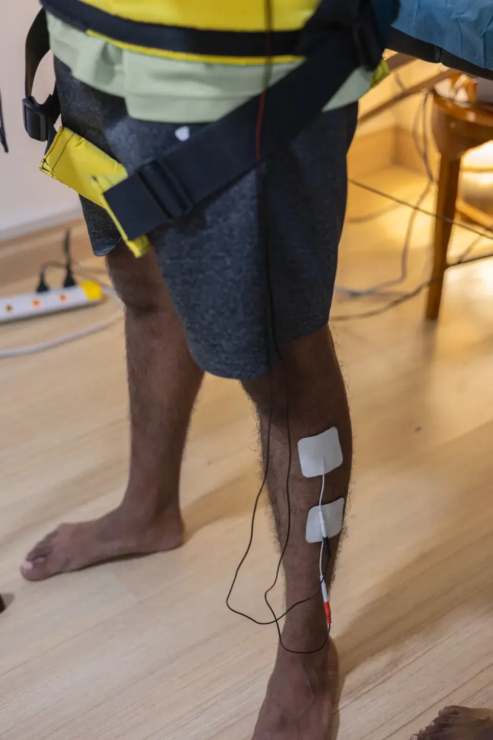 Patient receiving supervised rehabilitation with therapy equipment